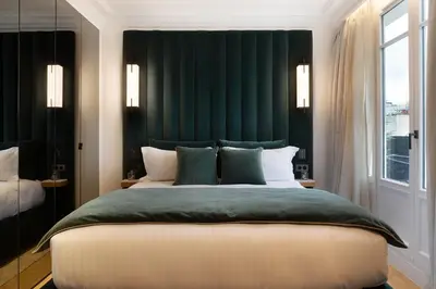 Un ou plusieurs lits dans un hébergement de l'établissement TheLander - Serviced Apartments in Champs Elysées
