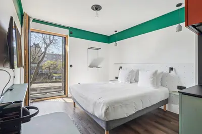Un ou plusieurs lits dans un hébergement de l'établissement All Suites Appart Hôtel et Hôtel - Paris 13 - Porte d'Italie