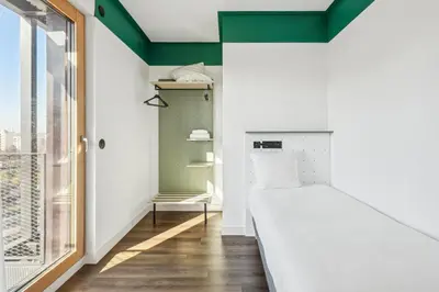 Un ou plusieurs lits dans un hébergement de l'établissement All Suites Appart Hôtel et Hôtel - Paris 13 - Porte d'Italie