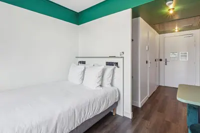 Un ou plusieurs lits dans un hébergement de l'établissement All Suites Appart Hôtel et Hôtel - Paris 13 - Porte d'Italie