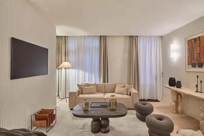 Télévision ou salle de divertissement dans l'établissement Résidence Louvre Palais Royal by Studio Prestige