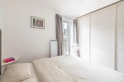 Un ou plusieurs lits dans un hébergement de l'établissement Geranimus Parisian Charm