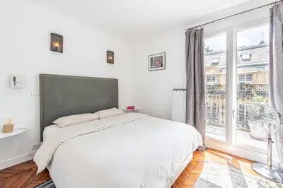 Un ou plusieurs lits dans un hébergement de l'établissement Geranimus Parisian Charm