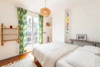 Un ou plusieurs lits dans un hébergement de l'établissement Geranimus Parisian Charm