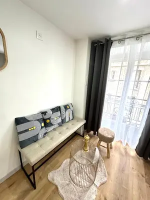 Coin salon dans l'établissement Hôtel Résidence A la Buttes aux Cailles