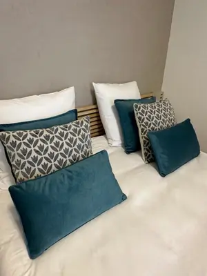 Un ou plusieurs lits dans un hébergement de l'établissement Hôtel Résidence A la Buttes aux Cailles