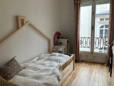 Un ou plusieurs lits dans un hébergement de l'établissement Deluxe Balcony Paris Gare de Lyon