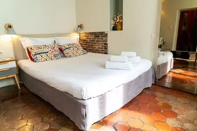 Un ou plusieurs lits dans un hébergement de l'établissement Studio cosy au cœur de Paris