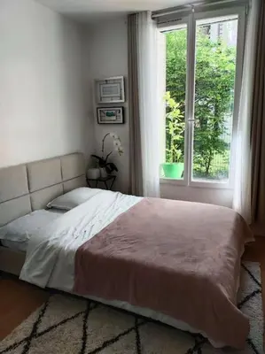 Un ou plusieurs lits dans un hébergement de l'établissement Charmant 2 pièces, au calme (meublé classé)