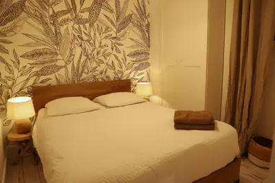 Un ou plusieurs lits dans un hébergement de l'établissement 2 chambres et une terrasse à Paris!