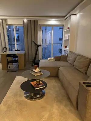 Coin salon dans l'établissement Appartement proche Étoile