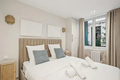 Un ou plusieurs lits dans un hébergement de l'établissement Cozy nest 2 steps from the Marais - 4 pers