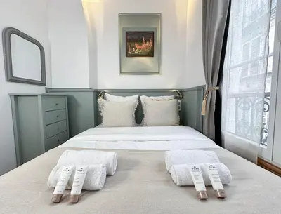 Un ou plusieurs lits dans un hébergement de l'établissement Opera - Prestige apartment with lift for 4