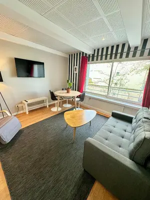 Télévision ou salle de divertissement dans l'établissement Appartement lumineux près de Montmartre 