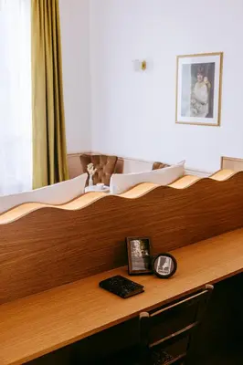 Un ou plusieurs lits dans un hébergement de l'établissement Le Charmant Hôtel