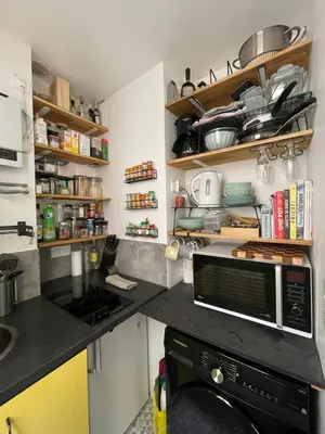 Cuisine ou kitchenette dans l'établissement Appartement de charme à proximité des puces
