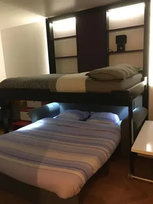 Un ou plusieurs lits dans un hébergement de l'établissement Studio avec balcon sur jardin et parking privé