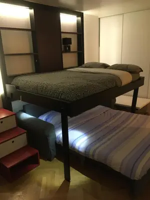 Un ou plusieurs lits dans un hébergement de l'établissement Studio avec balcon sur jardin et parking privé
