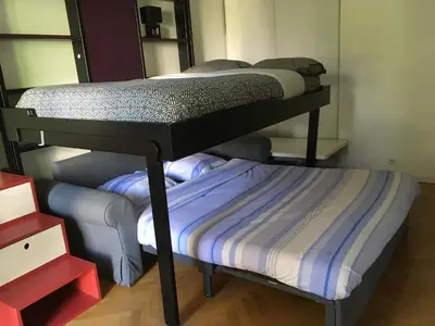 Un ou plusieurs lits dans un hébergement de l'établissement Studio avec balcon sur jardin et parking privé