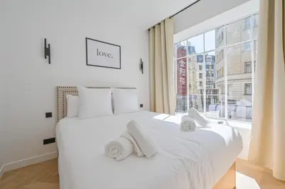 Un ou plusieurs lits dans un hébergement de l'établissement Lovely & Exclusive Parisian Flat