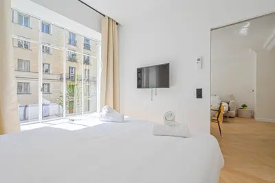 Un ou plusieurs lits dans un hébergement de l'établissement Lovely & Exclusive Parisian Flat