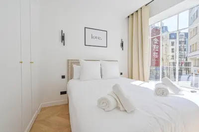 Un ou plusieurs lits dans un hébergement de l'établissement Lovely & Exclusive Parisian Flat