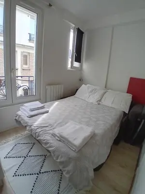 Un ou plusieurs lits dans un hébergement de l'établissement Paris 11 Studio