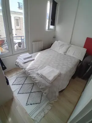 Un ou plusieurs lits dans un hébergement de l'établissement Paris 11 Studio