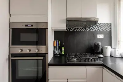 Cuisine ou kitchenette dans l'établissement Appartement spacieux aux portes de Paris