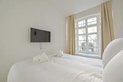 Un ou plusieurs lits dans un hébergement de l'établissement Luxurious & Famous Parisian Flat
