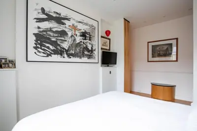 Un ou plusieurs lits dans un hébergement de l'établissement Chic Flat 2 rooms Georges V
