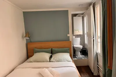 Un ou plusieurs lits dans un hébergement de l'établissement Appartement lumineux près des Galeries Lafayette