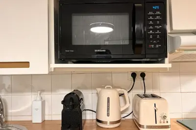 Cuisine ou kitchenette dans l'établissement Appartement lumineux près des Galeries Lafayette