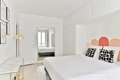 Un ou plusieurs lits dans un hébergement de l'établissement Appartement 2 pieces #TourEIffel #Invalides - II