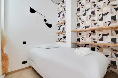 Un ou plusieurs lits dans un hébergement de l'établissement Elegant apartment - 3BR-7P - Moulin Rouge