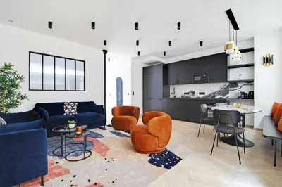 Coin salon dans l'établissement Elegant apartment - 3BR-7P - Moulin Rouge