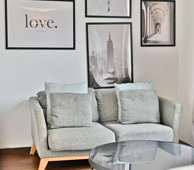 Coin salon dans l'établissement Appartement paisible et central Rivoli