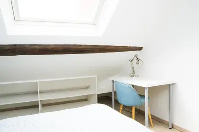 Un ou plusieurs lits dans un hébergement de l'établissement EXIGEHOME - Beau duplex-15 min Paris/La Défense/Champs Elysées