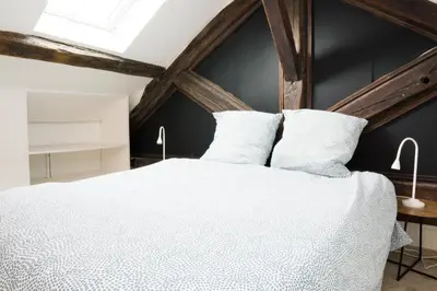 Un ou plusieurs lits dans un hébergement de l'établissement EXIGEHOME - Beau duplex-15 min Paris/La Défense/Champs Elysées
