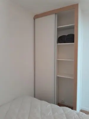 Un ou plusieurs lits dans un hébergement de l'établissement Bel appartement à deux pas de paris