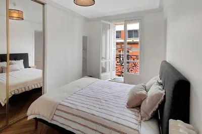 Un ou plusieurs lits dans un hébergement de l'établissement Amazing refurbished flat in Paris V