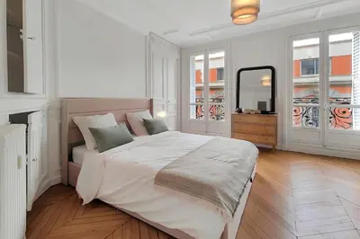 Un ou plusieurs lits dans un hébergement de l'établissement Amazing refurbished flat in Paris V