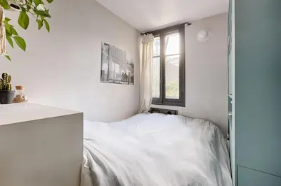 Un ou plusieurs lits dans un hébergement de l'établissement Trocadero/TourEiffel : havre de paix 2 Chambres
