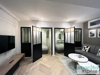 Télévision ou salle de divertissement dans l'établissement Urban Flat 178 - Cosy Chic 2 Bedroom Flat in Paris