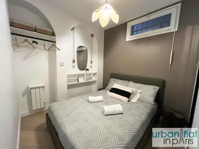 Un ou plusieurs lits dans un hébergement de l'établissement Urban Flat 178 - Cosy Chic 2 Bedroom Flat in Paris