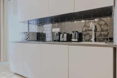 Cuisine ou kitchenette dans l'établissement Cozy apartment - 1BR-4P - Porte Saint-Denis