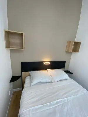 Un ou plusieurs lits dans un hébergement de l'établissement Appartement Bonne Nouvelle
