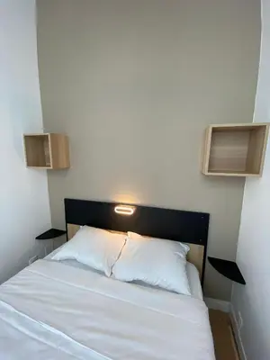 Un ou plusieurs lits dans un hébergement de l'établissement Appartement Bonne Nouvelle