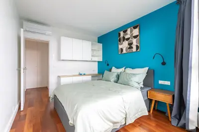 Un ou plusieurs lits dans un hébergement de l'établissement Comfortion Norma - Suite de luxe avec vue sur la Tour Eiffel