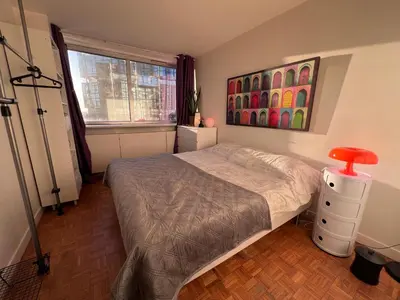 Un ou plusieurs lits dans un hébergement de l'établissement Tour Reflet Paris 15, A cozy and welcoming home, just like your own